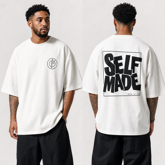 Front and back view of a man wearing an off-white oversized t-shirt. Front shows a small circular F icon on the left chest. Back shows a bold black block-lettered SELF MADE graphic in a rectangular box, with ORIGINAL GTA 2026 text below.