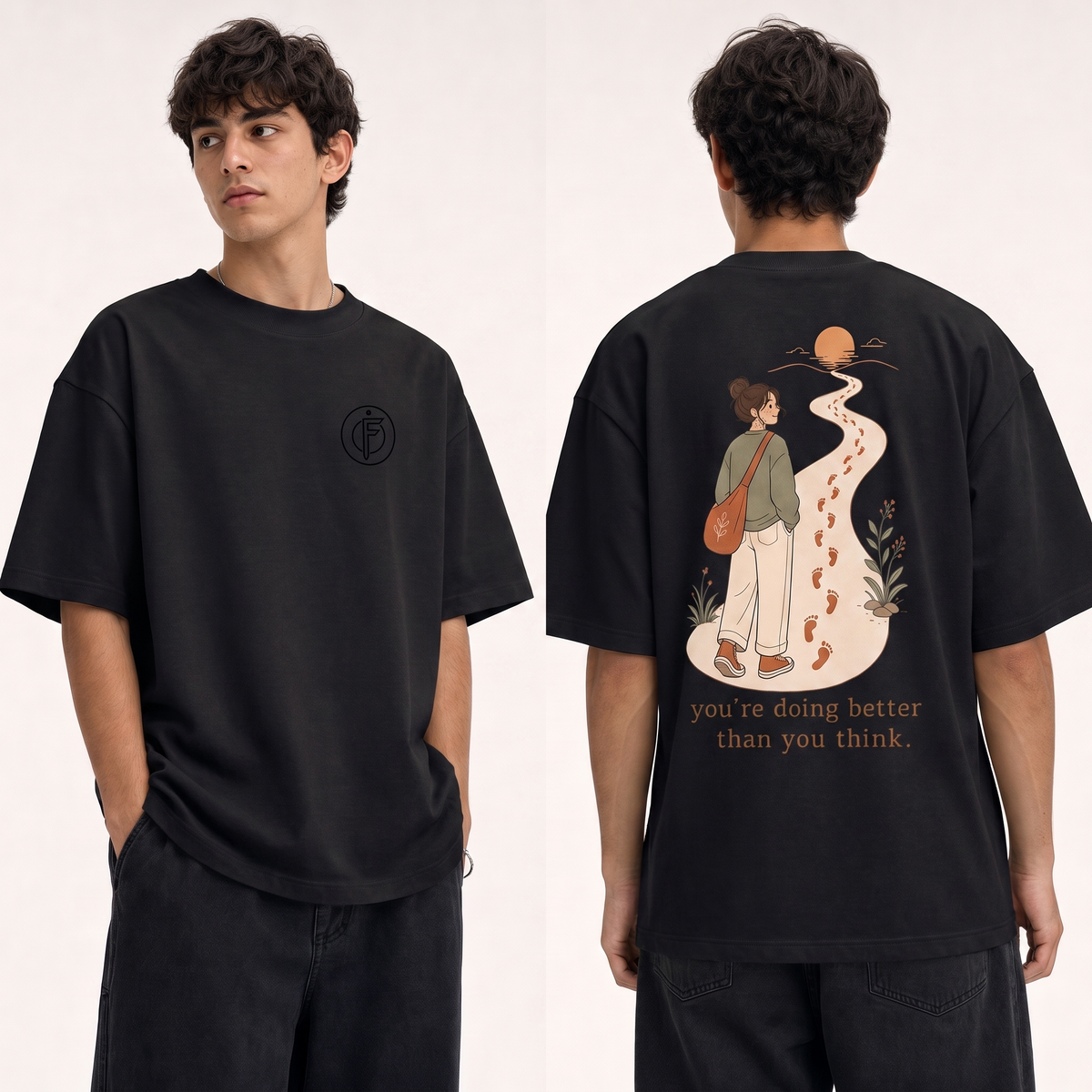 Editorial studio photo of a model wearing an oversized black heavyweight t-shirt with the full colorful YOU ARE DOING BETTER THAN YOU THINK graphic unchanged, relaxed streetwear fit, clean studio background.