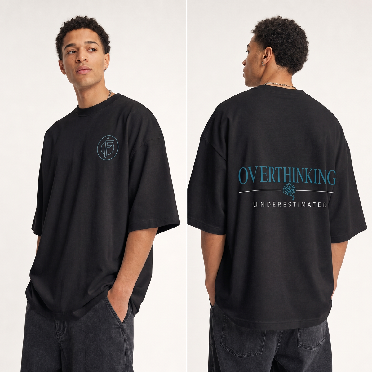 Editorial studio photo of a model wearing an oversized black heavyweight t-shirt with the OVERTHINKING, UNDERESTIMATED graphic, front and back views, relaxed streetwear fit, clean studio background.