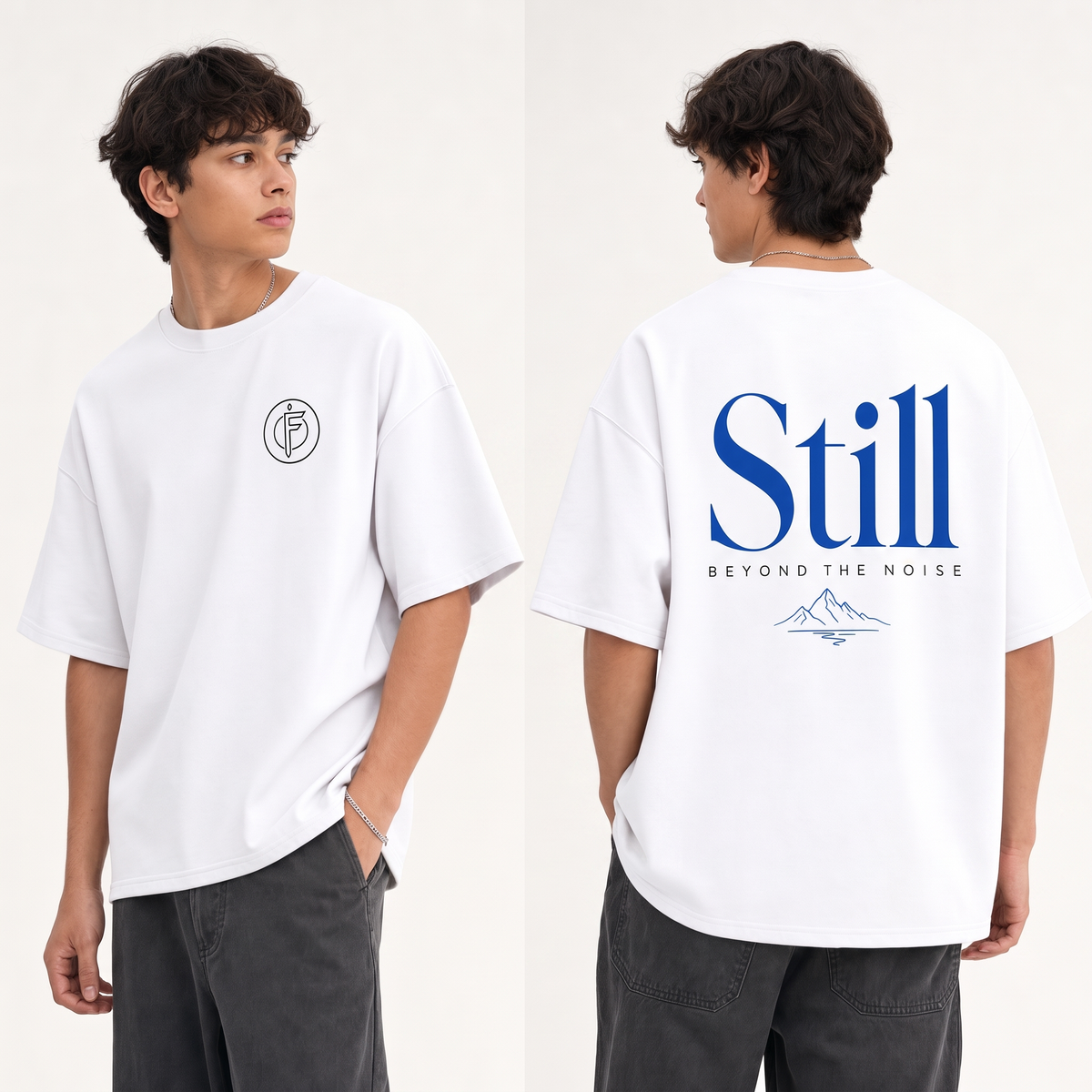 Editorial studio photo of a model wearing an oversized pure white heavyweight t-shirt with the STILL BEYOND THE NOISE graphic, front and back views, relaxed streetwear fit, clean studio background.